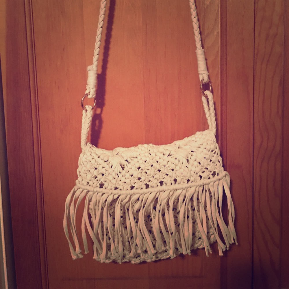 Cross body cream colored crotchet bag.